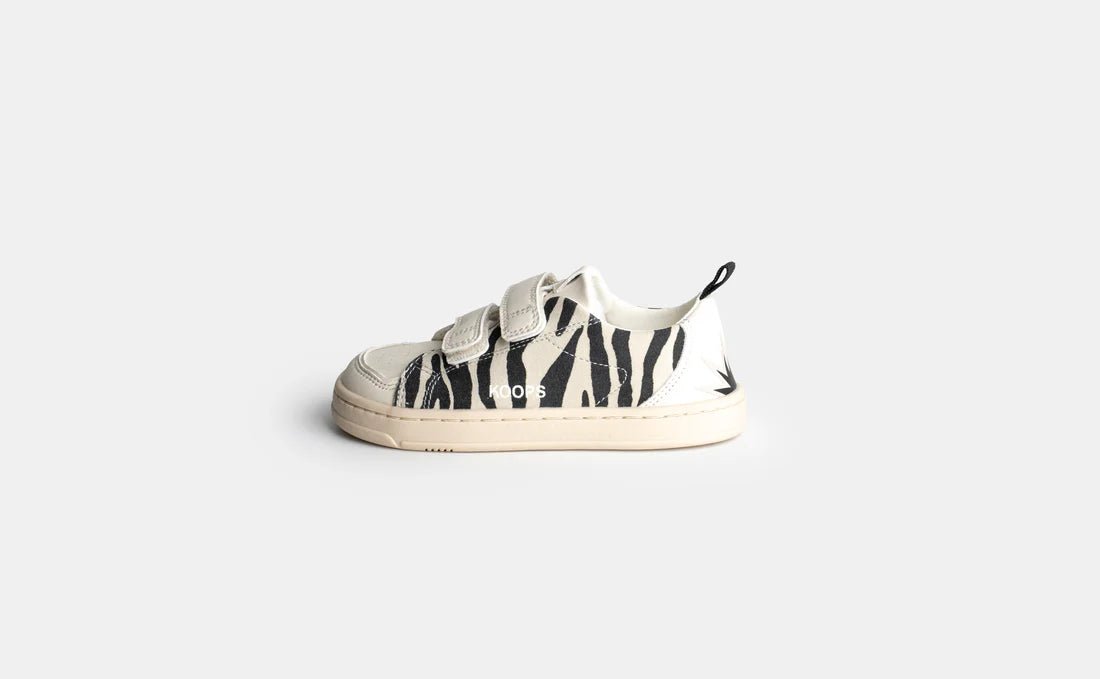 Koops Rafi Cebra, sabata respectuosa infantil amb estampat zebra, doble velcro i sola flexible.